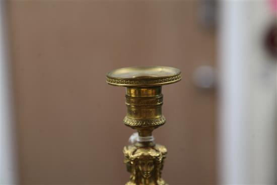 A pair of Empire style bronzed ormolu candlesticks, 10.5in.